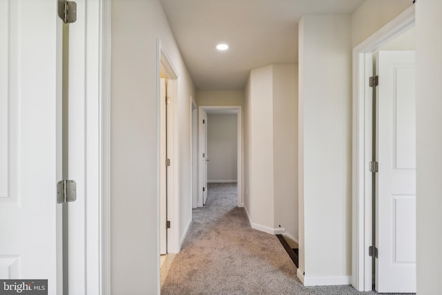 hallway with light carpet