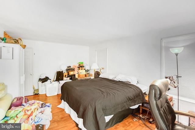 bedroom with light hardwood / wood-style floors