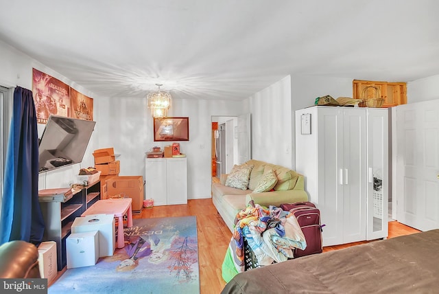 interior space featuring light hardwood / wood-style flooring and an inviting chandelier