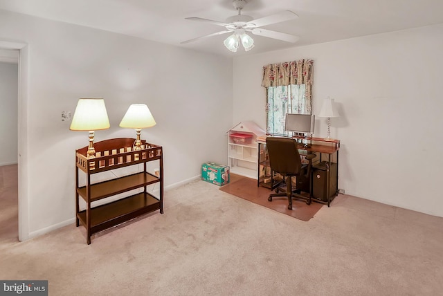 carpeted office with ceiling fan