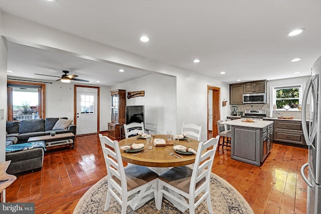 dining area featuring a wealth of natural light, hardwood / wood-style floors, and ceiling fan