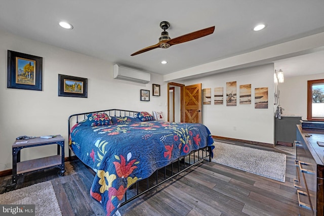 bedroom with ceiling fan, dark hardwood / wood-style floors, and a wall unit AC