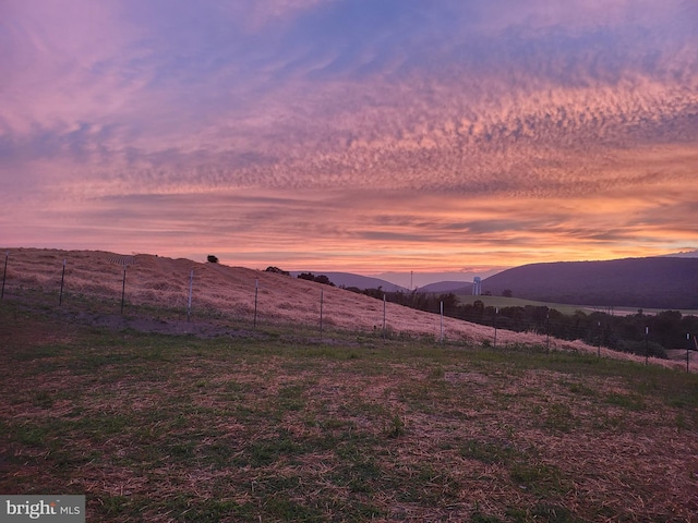 view of mountain feature with a rural view