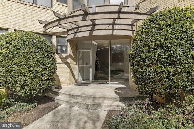 doorway to property featuring a pergola