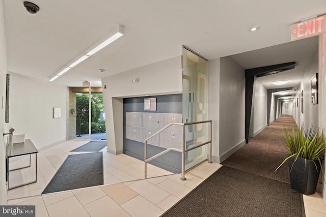 hallway with light tile patterned flooring