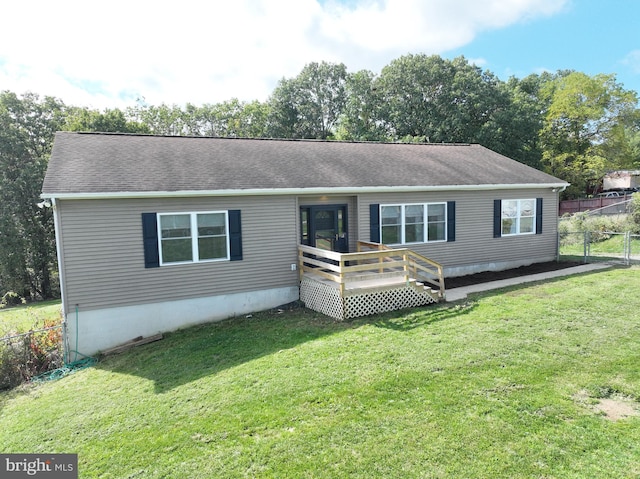 view of front of property with a front lawn and a wooden deck