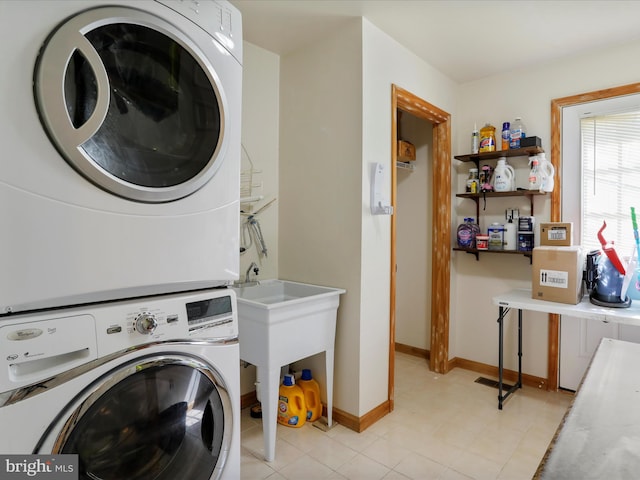 laundry area featuring stacked washer and clothes dryer