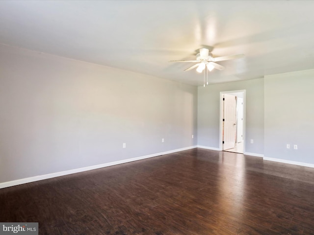 unfurnished room with ceiling fan and dark hardwood / wood-style floors