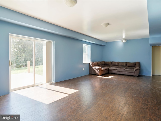 living room with dark hardwood / wood-style flooring