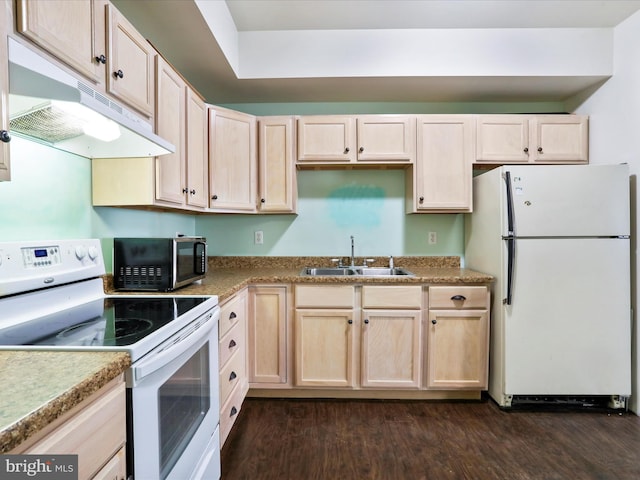 kitchen with light brown cabinetry, white appliances, sink, and dark wood-type flooring