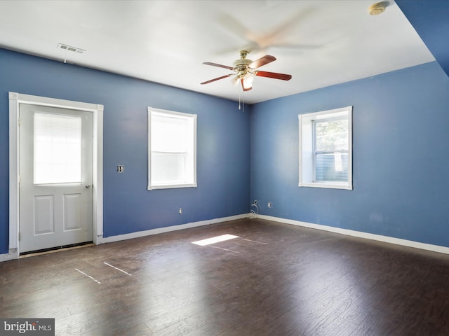 unfurnished room with ceiling fan and dark hardwood / wood-style floors