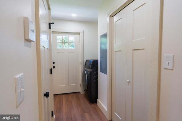 doorway to outside with washer / clothes dryer and dark hardwood / wood-style flooring