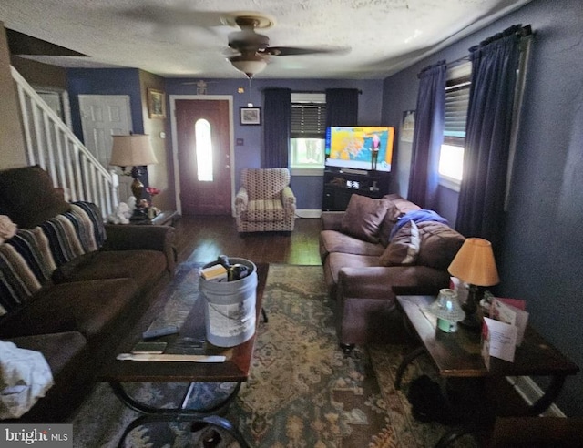 living room featuring hardwood / wood-style floors, a textured ceiling, plenty of natural light, and ceiling fan