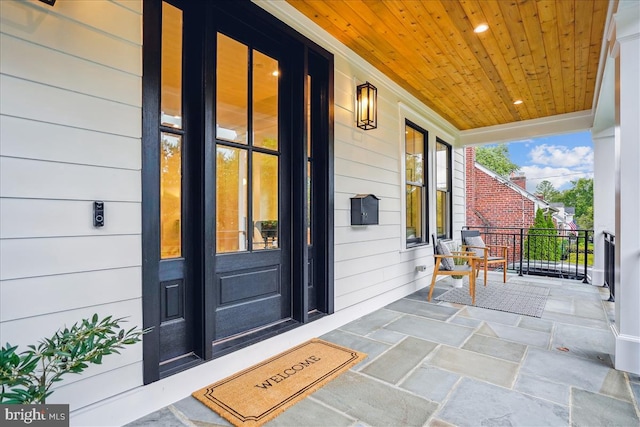 doorway to property with a porch