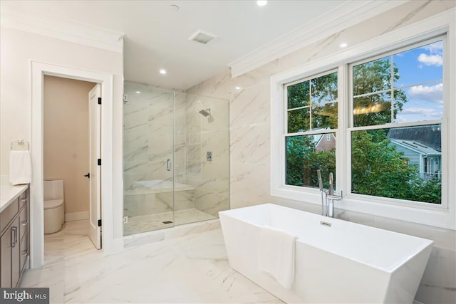 bathroom with ornamental molding, vanity, and separate shower and tub