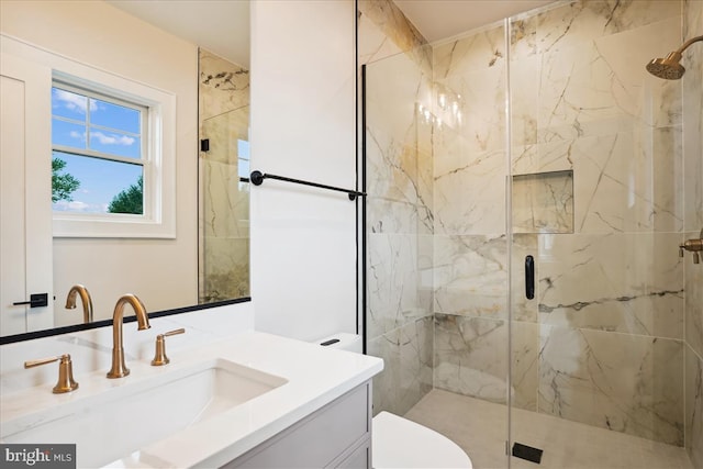 bathroom with walk in shower, vanity, and toilet