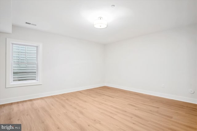 spare room with light hardwood / wood-style flooring