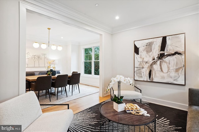 living room with crown molding and hardwood / wood-style floors