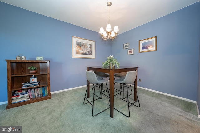 carpeted dining area featuring a chandelier