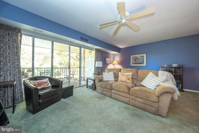 carpeted living room with ceiling fan