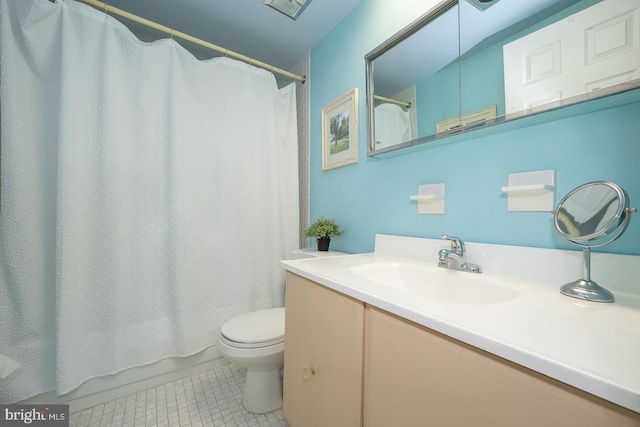 bathroom featuring toilet and vanity