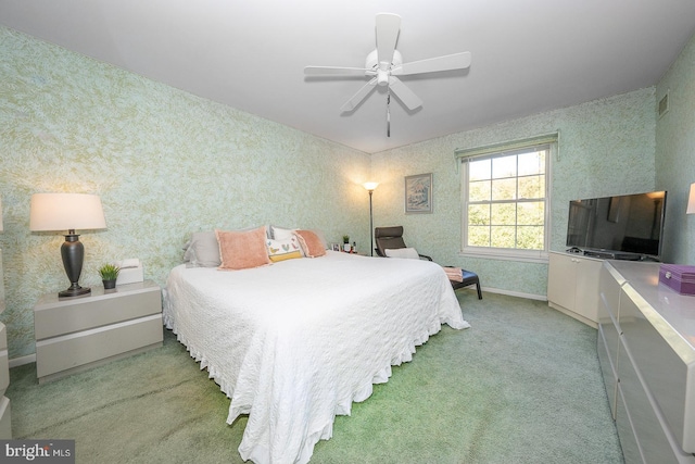 bedroom with ceiling fan and light colored carpet