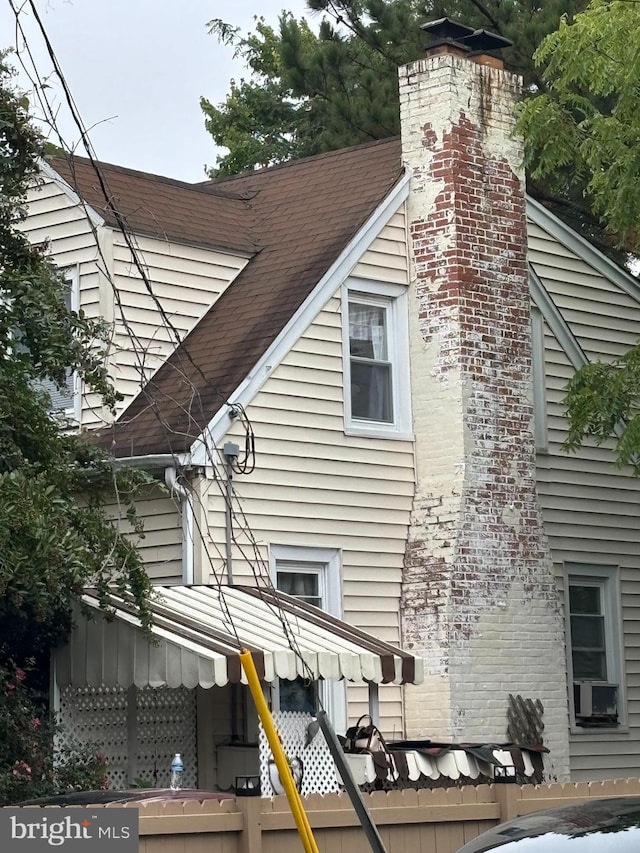 view of home's exterior with cooling unit