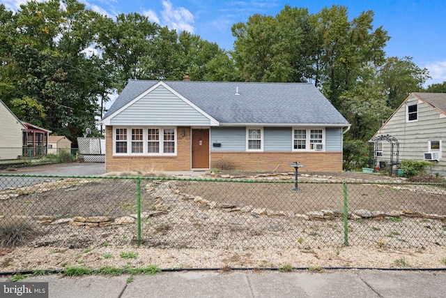 single story home featuring cooling unit