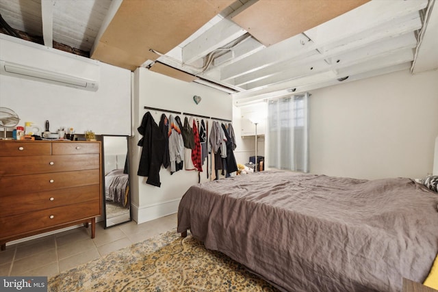 tiled bedroom featuring a closet and a wall mounted AC