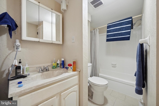 full bathroom featuring tile patterned floors, toilet, shower / tub combo with curtain, and vanity