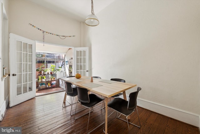 dining space featuring french doors and dark hardwood / wood-style floors