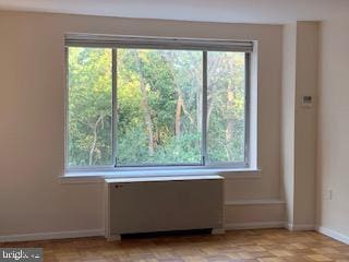 interior space with a wealth of natural light and baseboards
