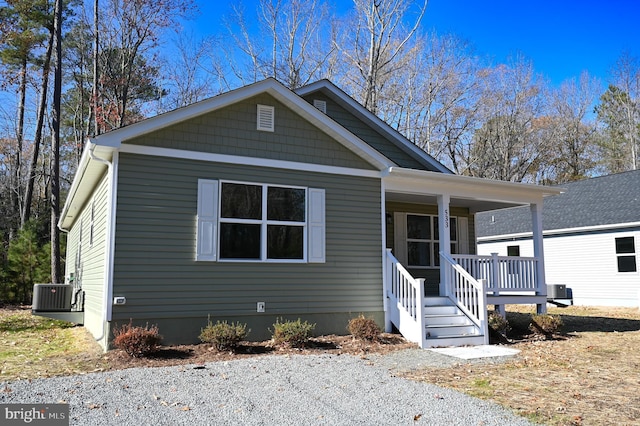 view of front of house featuring cooling unit and covered porch