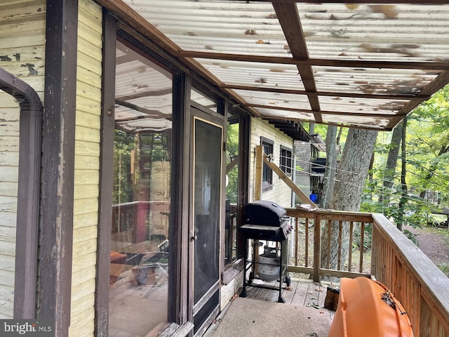 wooden terrace featuring area for grilling