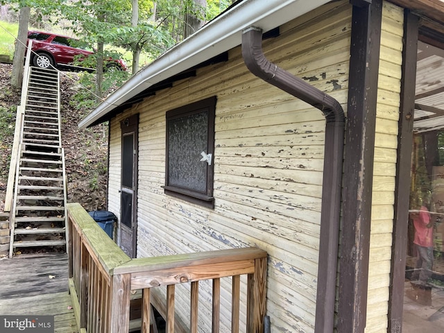 view of property exterior with a deck