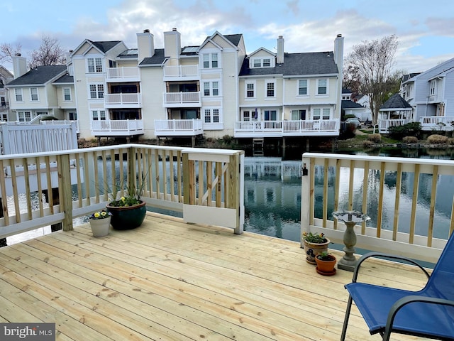 wooden deck featuring a water view