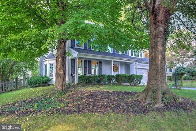 view of front of home with a garage and a front yard