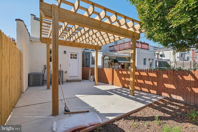 view of patio / terrace featuring central AC and a pergola