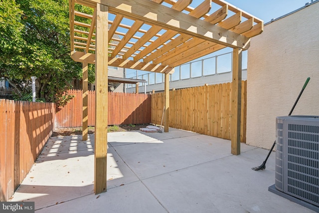 view of patio featuring central AC unit and a pergola