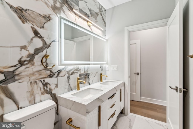 bathroom with toilet and vanity