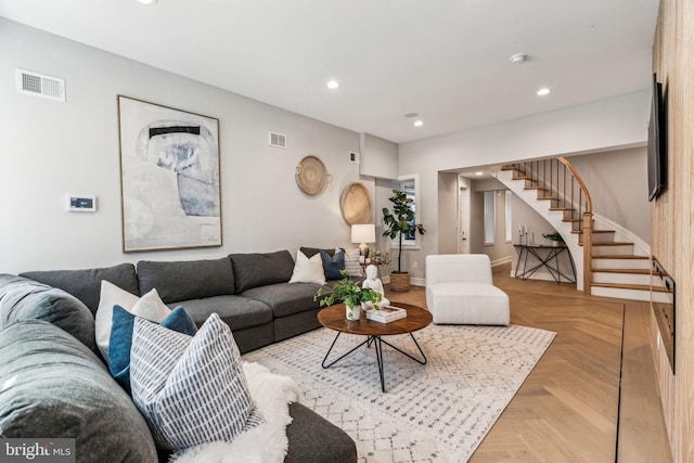 living room featuring light parquet flooring