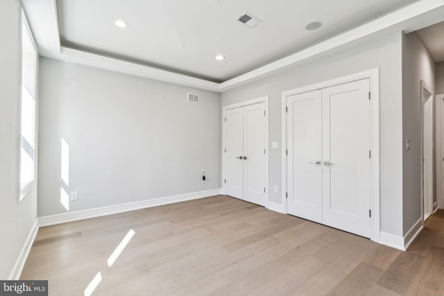 unfurnished bedroom with light hardwood / wood-style floors