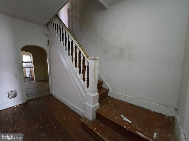 stairway with wood-type flooring