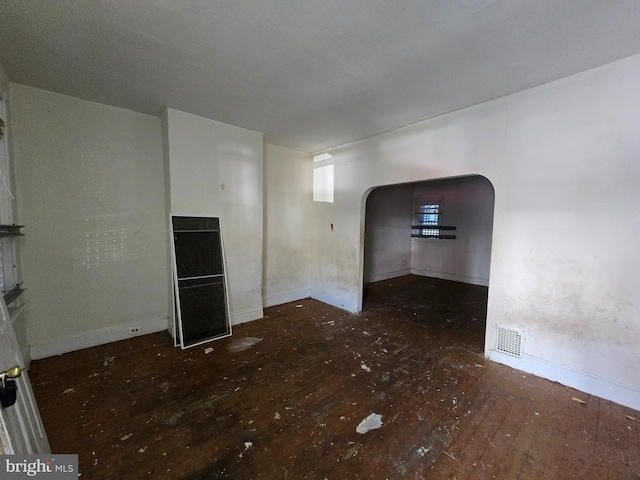 empty room with dark wood-type flooring