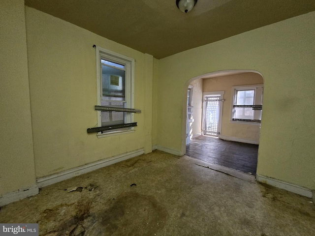 spare room featuring wood-type flooring