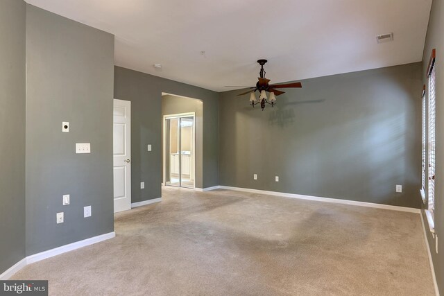 carpeted empty room with ceiling fan