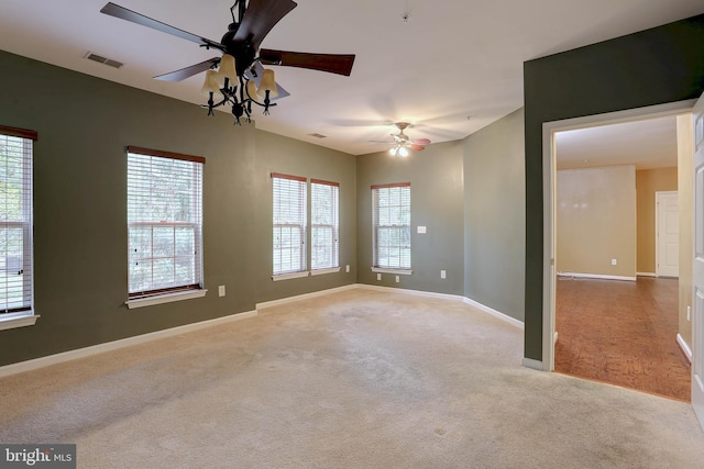 carpeted empty room with ceiling fan