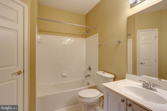 full bathroom featuring tile patterned flooring, vanity, toilet, and tiled shower / bath