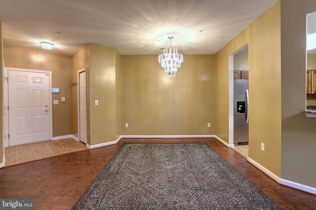 entrance foyer featuring a notable chandelier