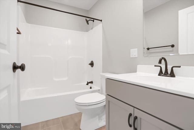 full bathroom with tile patterned flooring, vanity, toilet, and shower / tub combination